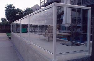 Custom Glass Wall Surrounding Swimming Pool
